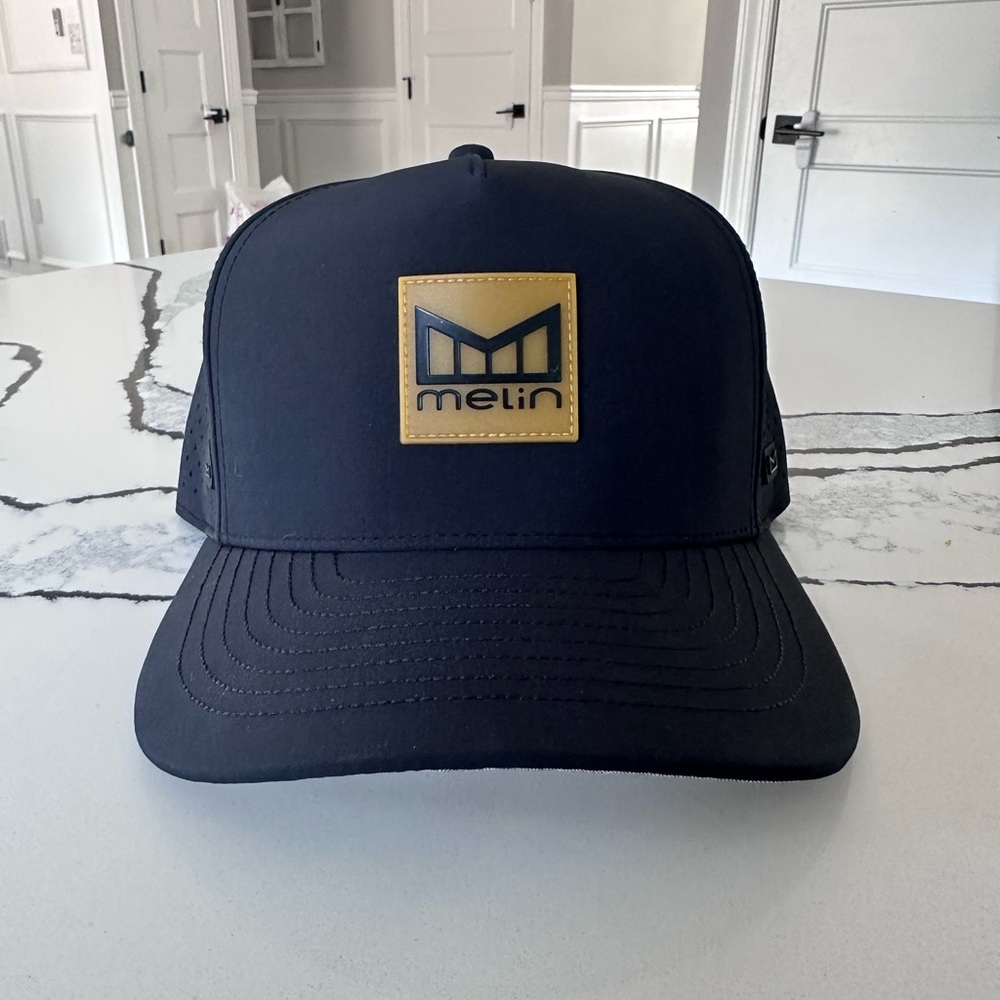 Melin Black Cap with Gold Logo